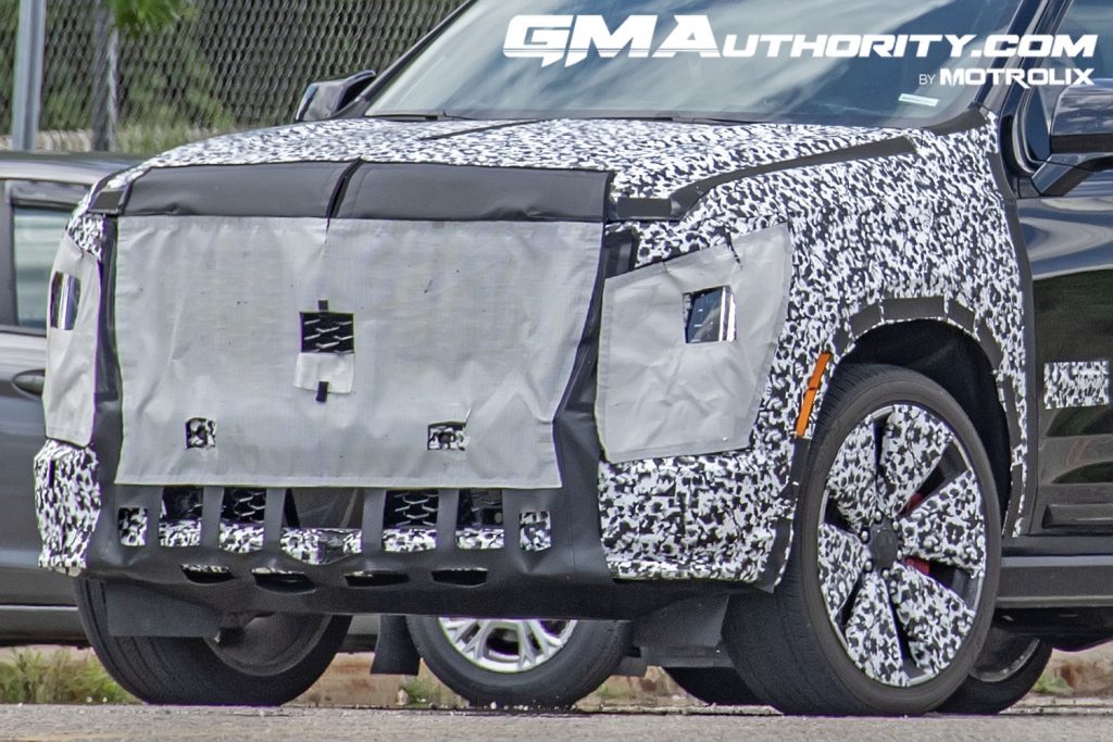 The refreshed 2025 Cadillac Escalade as a camouflaged prototype.