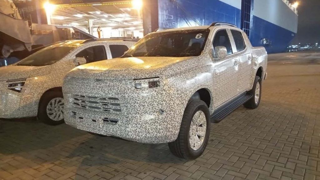 Front three-quarters view of the camouflaged 2025 Chevy S10 prototype.
