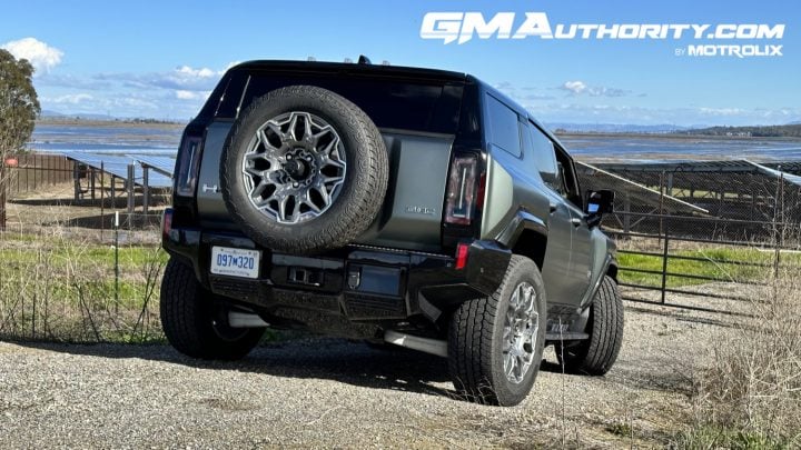 Rear three quarters view of the GMC Hummer EV SUV. 