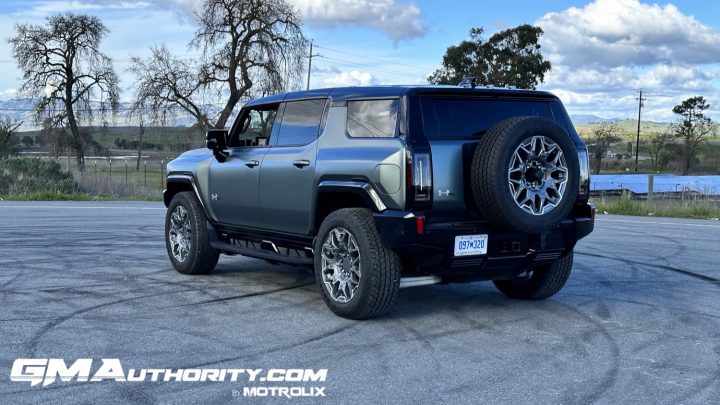 Rear three quarters view of the GMC Hummer EV SUV. 