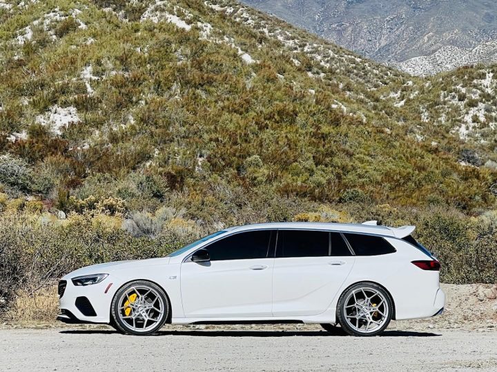 A custom Buick Regal GS TourX sitting on aftermarket 21-inch wheels.