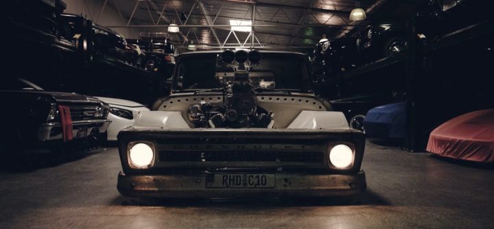 The front end of a modified Chevy C10.