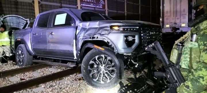 A destroyed GMC Canyon pickup.