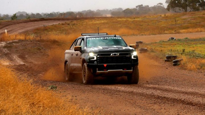Chevy Silverado ZR2 Off-Road Racer shown here driving around a dirt track.