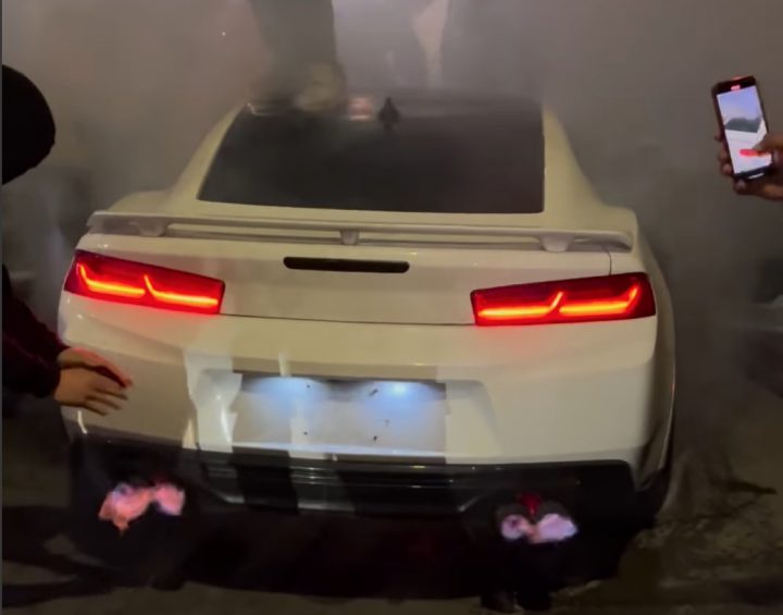 A Chevy Camaro moments before it's set on fire.