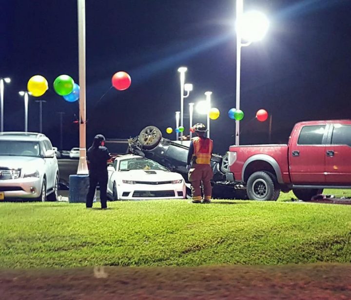 A Chevy Camaro Z/28 crushed by a Nissan Z.