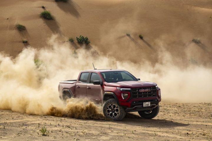 Image of the 2024 GMC Canyon AT4X running through the Middle East desert.