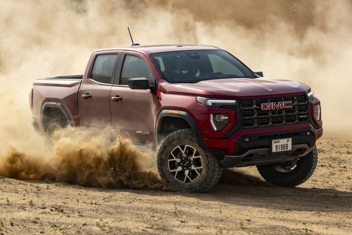 2025 GMC Canyon AT4X driving in a desert.