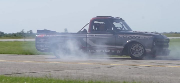 A Chevy C10 burns rubber on an airstrip.