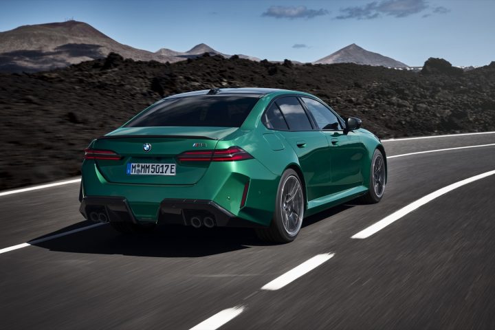 Rear three quarters view of the 2025 BMW M5 sedan. 