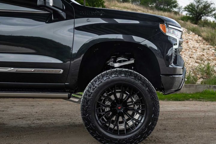 Front end of a Chevy Silverado High Country riding on Ferrada FTR9 wheels.