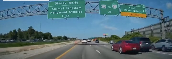 A Chevy Camaro weaves through traffic moments before colliding with another motorist.