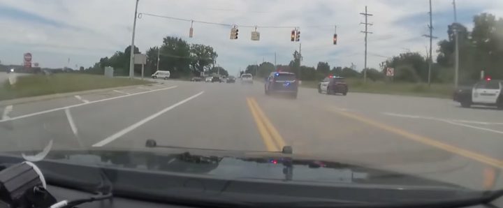A GMC Sierra pickup flees from police.