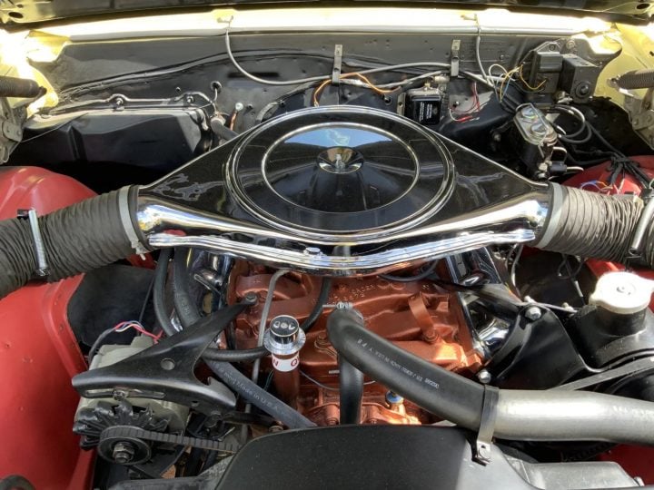 A 400 cubic-inch V8 engine in a 1967 Oldsmobile 442 W-30.