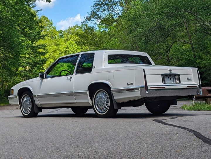 The rear three-quarters view of a 1991 Cadillac Coupe DeVille.