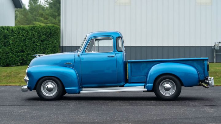 Side view of the 1954 Chevy 3100 five-window pickup heading to auction.