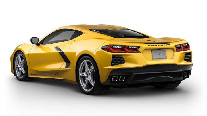 Rear three quarters view of the 2025 Corvette in Competition Yellow Tintcoat Metallic.