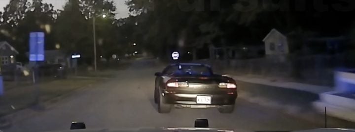 A Chevy Camaro Convertible leading police on a high-speed chase.