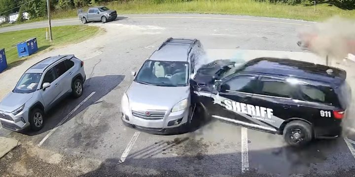 A Saturn Outlook destroyed by a speeding police SUV.