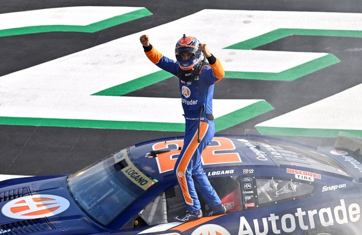 Joey Logano celebrating his victory. Daniel Suárez finished second aboard the No. 99 NASCAR Chevy Camaro ZL1.