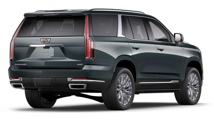 Rear three quarters view of the 2025 Cadillac Escalade in Aegean Stone. 