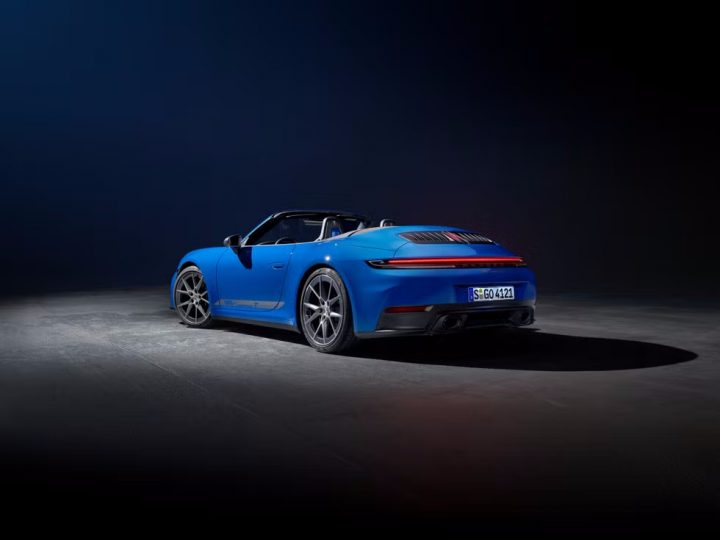 2025 Porsche 911 Carrera T Cabriolet rear three quarter angle.