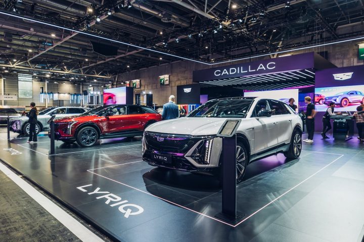 Front three-quarters view of the Cadillac Lyriq and Optiq in Cadillac EV stand at 2024 Paris Motor Show.