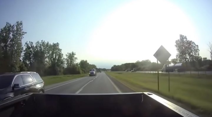 A Chevy Traverse moments before it's hit by a semi truck.