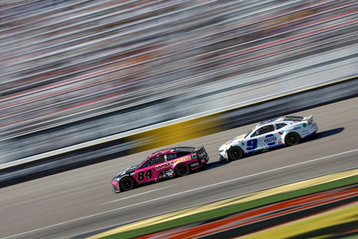 Chase Elliott's No. 9 NASCAR Chevy Camaro ZL1 behind Jimmie Johnson's No. 84 Toyota TRD Camry.