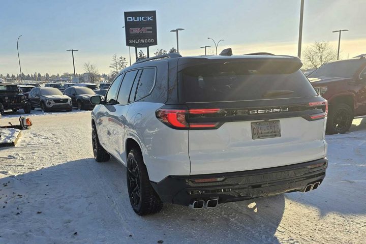 Rear view of the customer 2024 GMC Acadia Denali. 