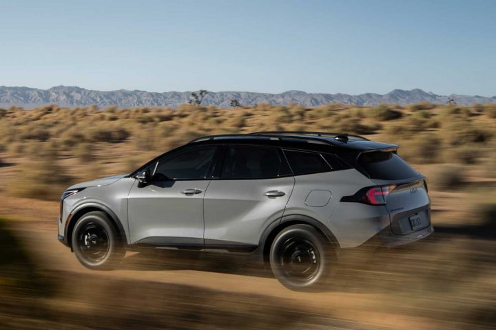 2026 Kia Sportage driving on a trail.
