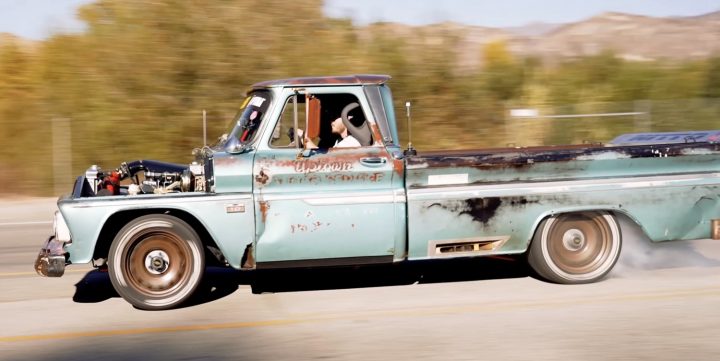 A Chevy C10 does a burnout.