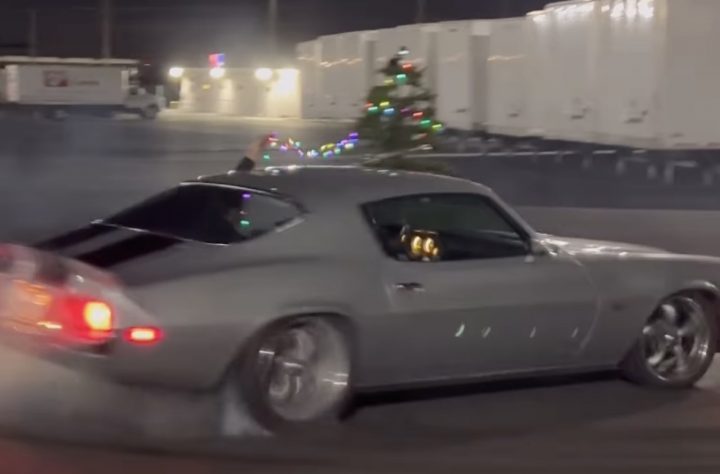 A Chevy Camaro burning rubber and decorating a Christmas tree.