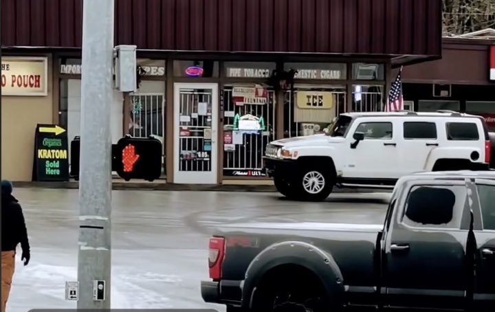 A Hummer H3 in an icy parking lot.