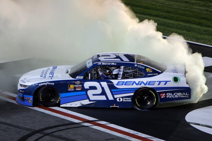 Photo of NASCAR Chevy driver Austin Hill after winning an Xfinity Series race in 2025. Hill has been suspended for one race due to intentionally wrecking a rival. 