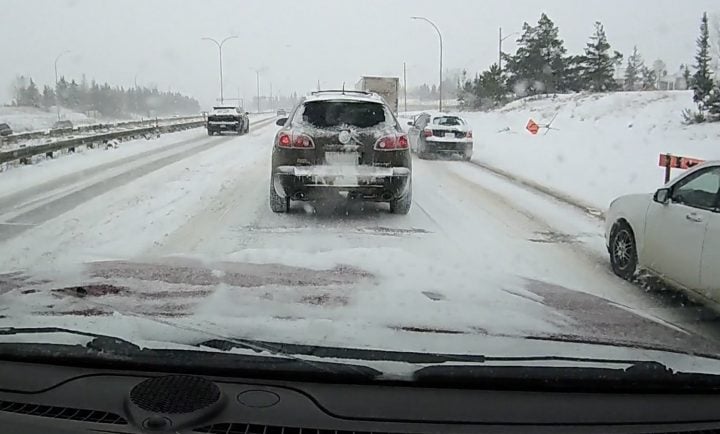 Buick Enclave on a snowy road.