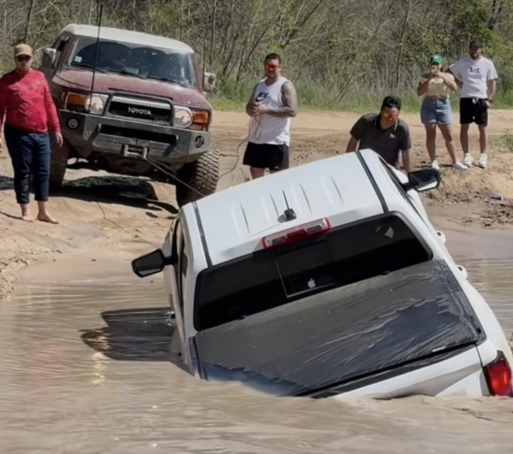 A Chevy Colorado is rescued from a mud pit.