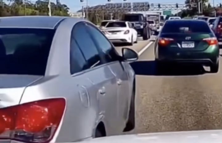 A Chevy Cruze cuts off traffic.