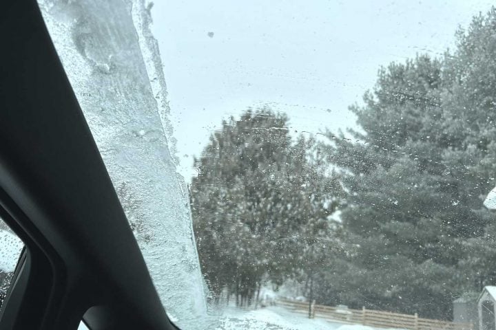 Chevy Equinox EV with snowy windshield.