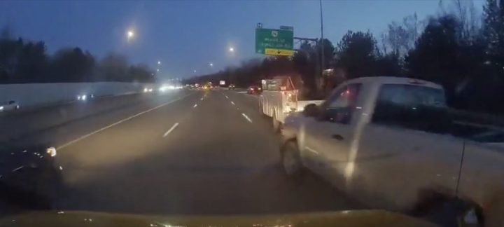 A Chevy Silverado swerves between lanes.