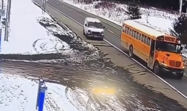 GMC Savana makes an illegal pass around a school bus.