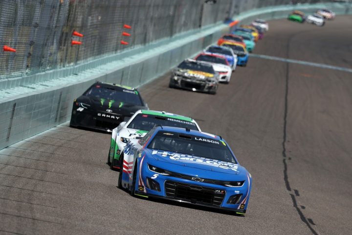 Photo showing a general view of racing at Homestead-Miami Speedway, with the No. 5 NASCAR Chevy of Kyle Larson in the lead. 