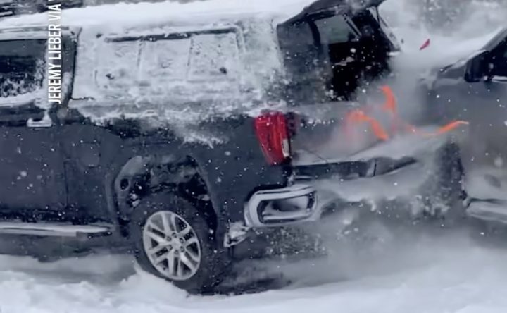 A Toyota SUV crashes into a GMC Sierra.