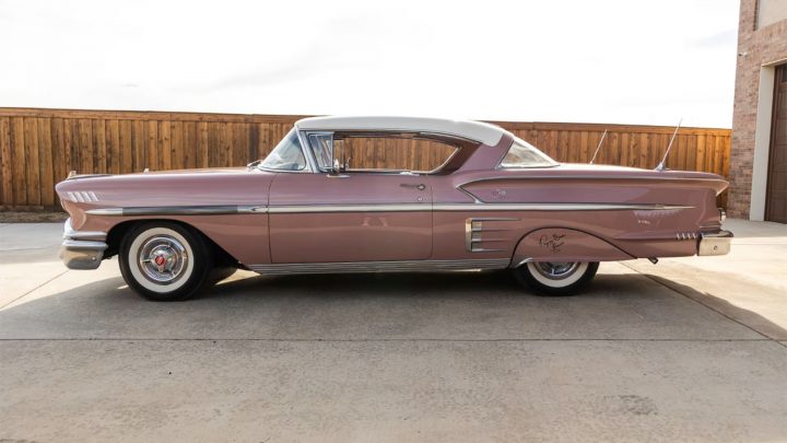 Side profile view of the 1958 Chevy Impala coupe headed to auction.