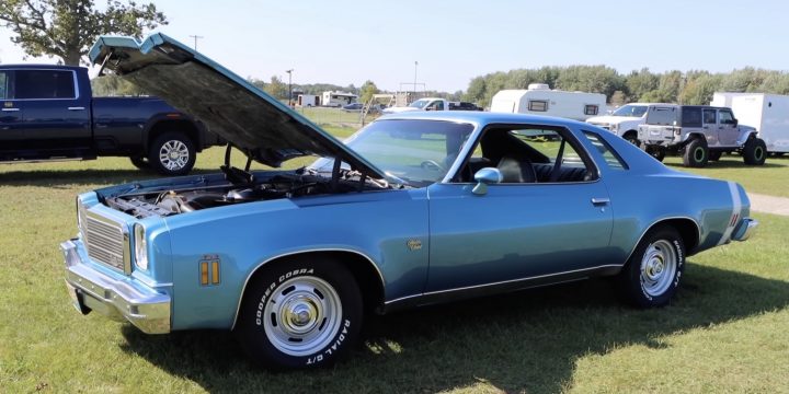 A 1974 Chevelle with its hood up.