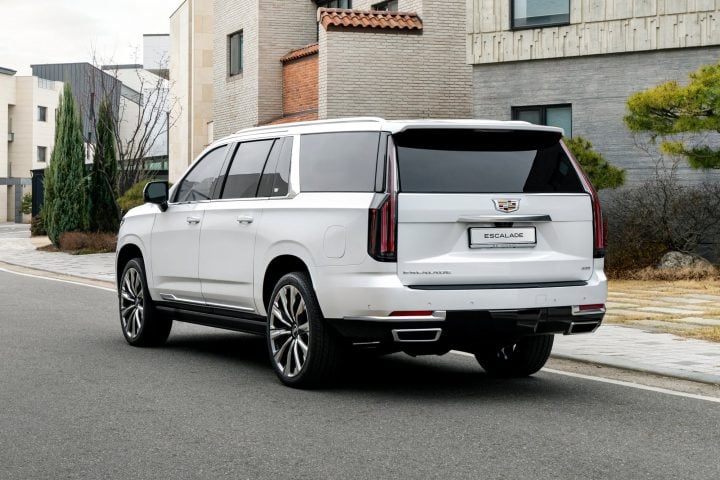 Rear three-quarters view 2025 Cadillac Escalade ESV Premium Luxury Platinum. Cadillac Escalade outsold all rivals combined again during Q1 2025.