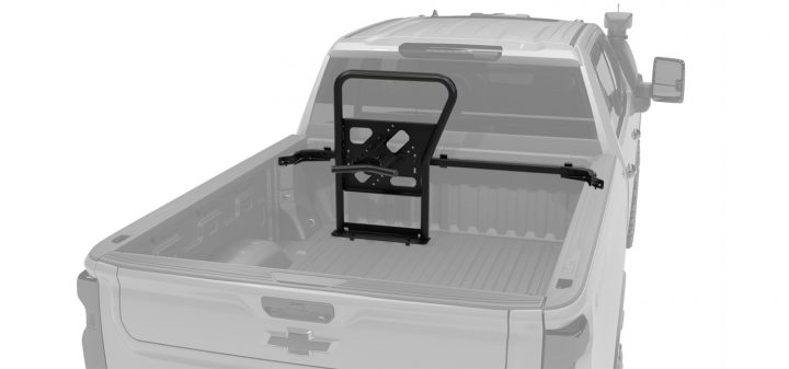 Chevy Silverado HD with an aftermarket vertical spare tire mount.