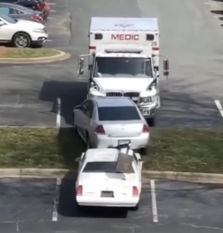 An ambulance rams multiple GM vehicles.