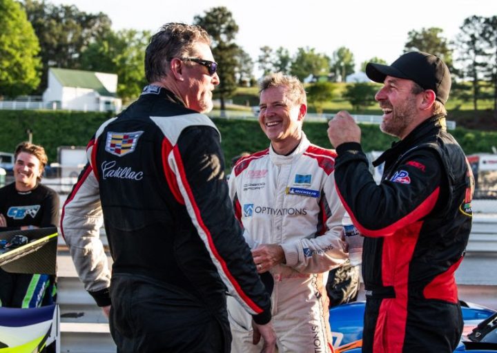Photo of the No. 02 Cadillac DPi team chatting on the grid before the 2025 Road Atlanta HSR Prototype Challenge race. They went on to win their category, along with the No. 09 Corvette DP in its category. 