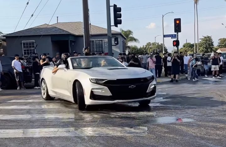 A Chevy Camaro at a street takeover in LA.